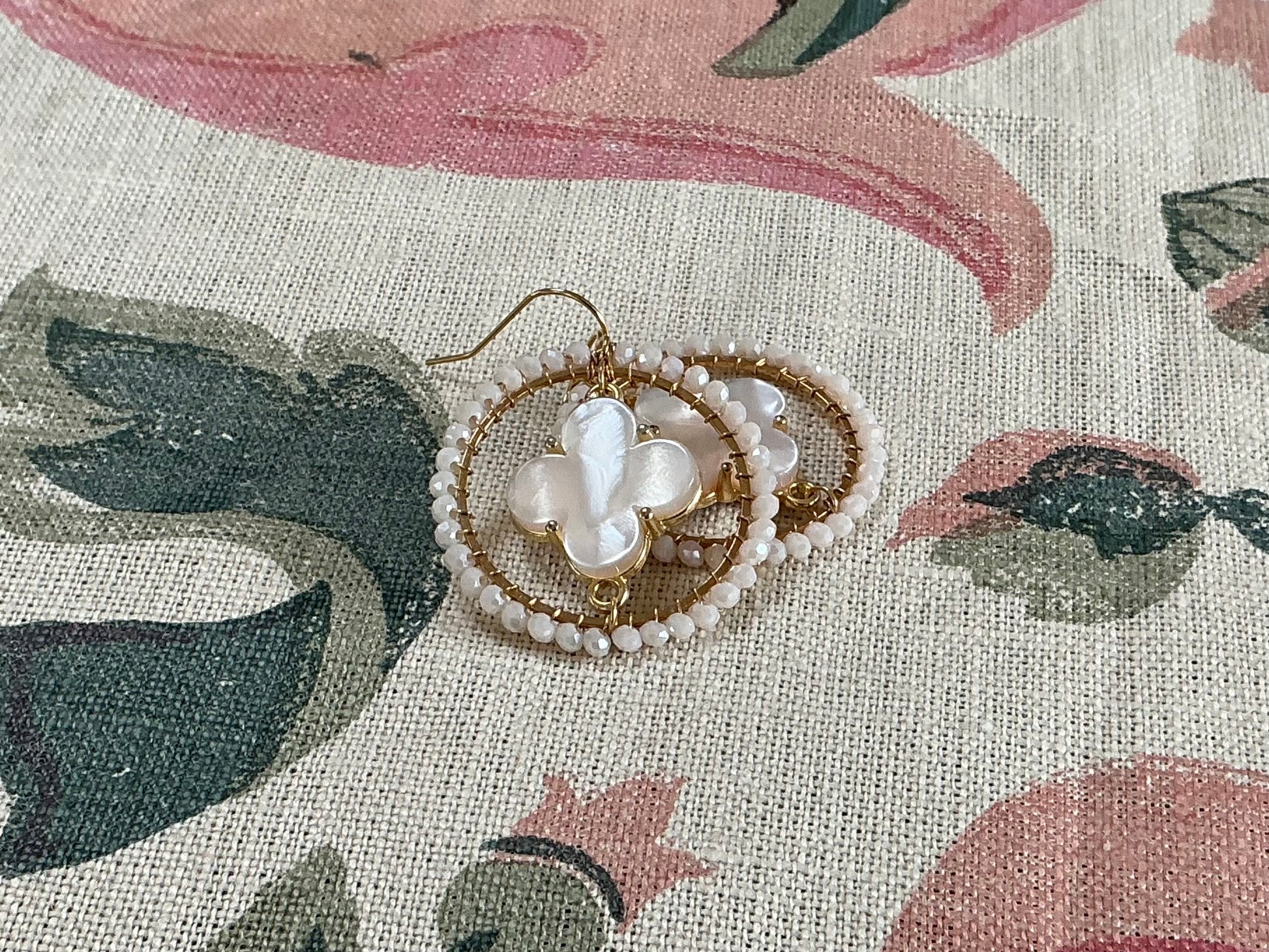 Cream and gold beaded clover earrings by Willa Grace with  faceted beaded detailing